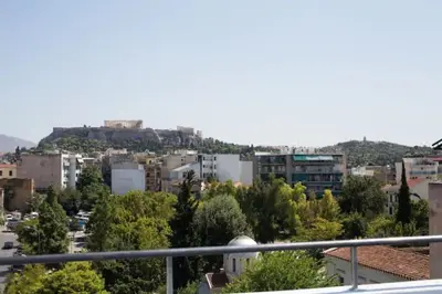 a view of a city from a balcony at A comfortable small studio nearby Acropolis 5 in Athens
