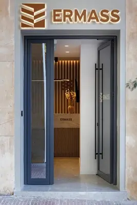 an entrance to a store with a glass door at ERMASS Athens in Athens