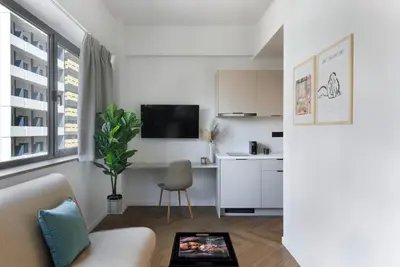 a living room with a couch and a table at ERMASS Athens in Athens