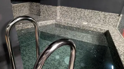 a shower with a glass enclosure with a shower at ERMASS Athens in Athens
