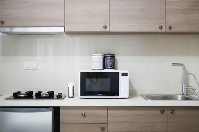 a microwave sitting on a counter in a kitchen at A comfortable small studio nearby Acropolis 202 in Athens