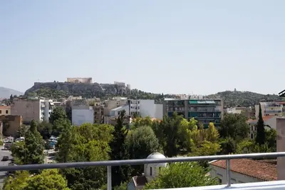 a view of a city from a balcony at A comfortable small studio nearby Acropolis 203 in Athens