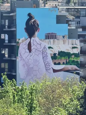 a billboard with a woman in front of a building at A comfortable small studio nearby Acropolis 203 in Athens