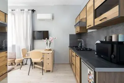 a kitchen with a table and a dining room at Small studio under Acropolis B! in Athens