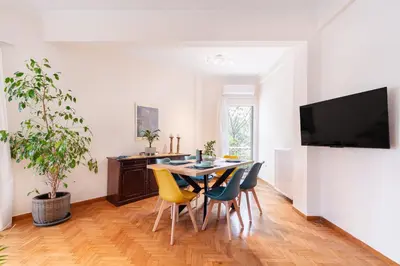a dining room with a table and chairs at Edem Beach Apartment by Alimos Marina - Athenian Homes in Athens
