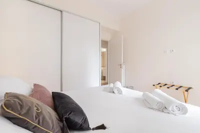 a room with two pillows and a mirror at Edem Beach Apartment by Alimos Marina - Athenian Homes in Athens