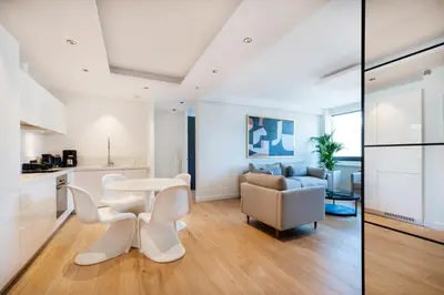 a kitchen and living room with a table and chairs at Top Notch Stay In Kolonaki in Athens