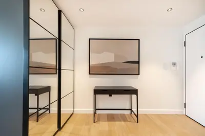 a room with two tables and a picture on the wall at Top Notch Stay In Kolonaki in Athens