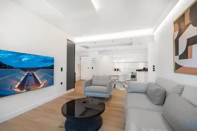 a living room with a couch and a table at Top Notch Stay In Kolonaki in Athens