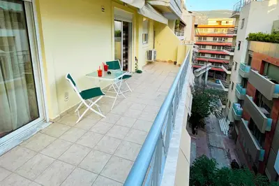 a balcony with a table and chairs on a building at DSL - Downtown Skyline Loft in Athens