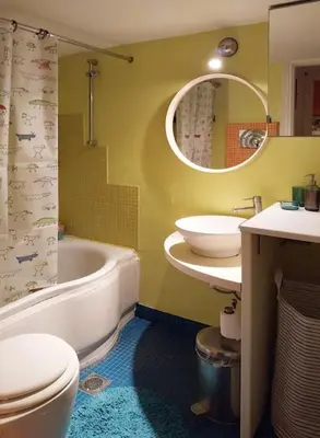 a bathroom with a tub and a toilet and a sink at Lucie's Apartment in Athens