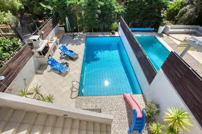 an overhead view of a swimming pool in a backyard at Saronida Hills private Pool in Saronida