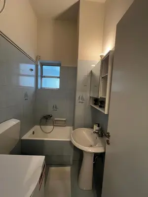 a bathroom with a sink and a toilet and a tub at Sirius Escape in Spáta