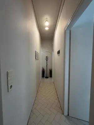 a corridor of a hallway with white walls and a ceiling at Sirius Escape in Spáta