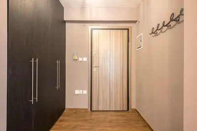 a hallway with a door in a room at Athens Seaside Retreat Floisvos in Athens