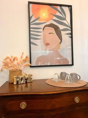 a picture of a woman on top of a wooden table at Athena3 in Athens