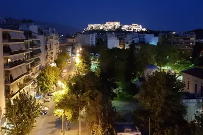 an aerial view of a city at night at Special studio in the heart of Athens! in Athens