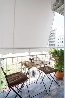 a balcony with a table and two chairs at Special studio in the heart of Athens! in Athens