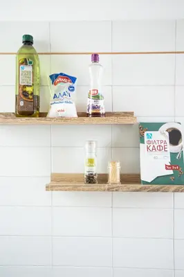 a shelf in a bathroom with food items on it at Athinais in Athens