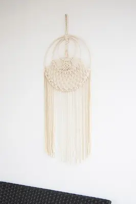 a white chandelier hanging from a white wall at Athinais in Athens