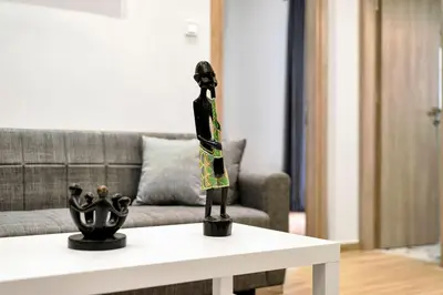 a statue on a coffee table in a living room at Artemis Modern Apartment in Athens