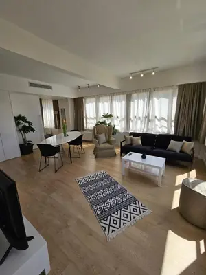 a living room with a couch and a table at Athenian Spirit by Acropolis in Athens