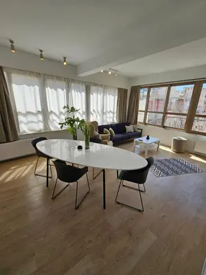 a living room with a white table and chairs at Athenian Spirit by Acropolis in Athens