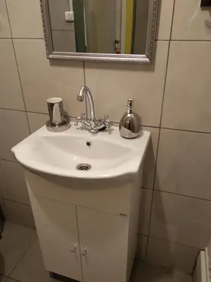 a bathroom with a white sink and a mirror at Acropolis Ermou Rooms at Plaka in Athens