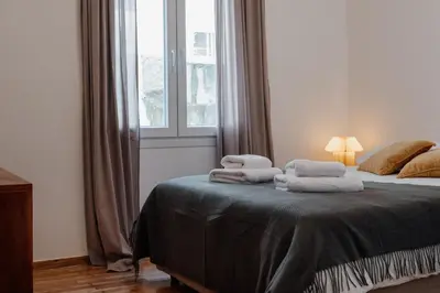 a bedroom with a bed with towels on it at Dylan in Athens