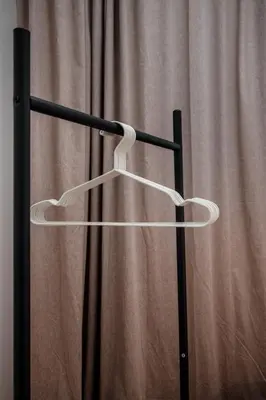 a white hanger in front of a curtain at Dylan in Athens
