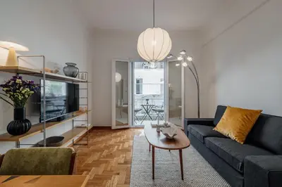 a living room with a couch and a table at Dylan in Athens