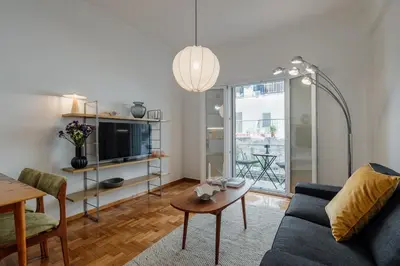 a living room with a couch and a table at Dylan in Athens