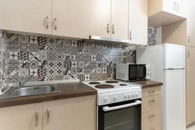 a kitchen with a stove and a microwave at Spacious Peaceful Family 2BD APT in Athens