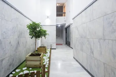 a hallway of a house with plants in wooden boxes at Unforgettable holidays two steps from Acropolis 3 in Athens