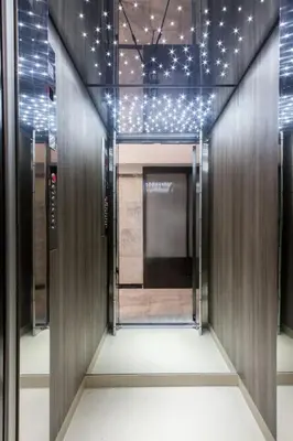 a hallway of a building with lights on the ceiling at Unforgettable holidays two steps from Acropolis 3 in Athens