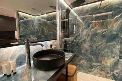 a bathroom with a sink and a large mural at Alfa Luxury Home 3 in Athens
