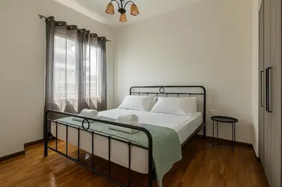 a bedroom with a bed and a window at Coloneum 1BD Cozy Apartment in Athens Kolonos in Athens