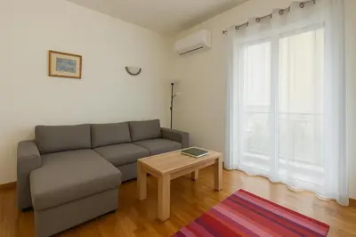 a living room with a couch and a table at Coloneum 1BD Cozy Apartment in Athens Kolonos in Athens