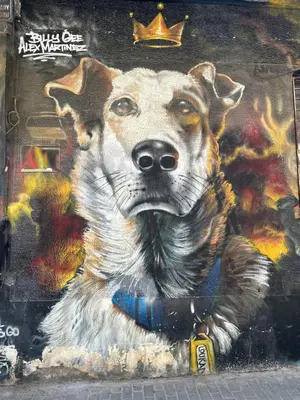 a painting of a dog on a wall at Urban Retreat , Psirri Athens City Center in Athens