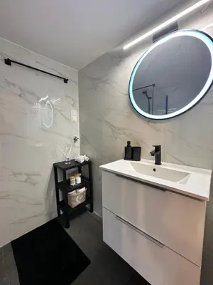a bathroom with a sink and a mirror on the wall at Urban Retreat , Psirri Athens City Center in Athens