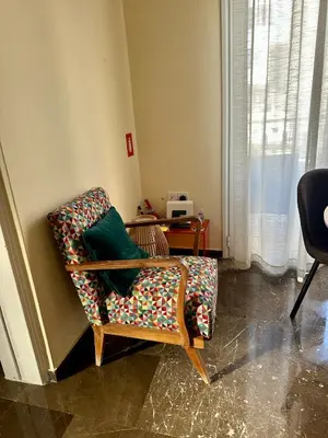 a living room with a couch and a chair at Midcentury Modern Apartment in Piraeus