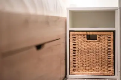 a room with a window and a door with a basket at Elegant Athens Downtown Studio in Athens