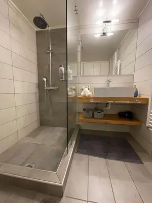 a bathroom with a shower and a sink at Kate's Nest Athens in Athens