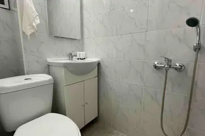 a bathroom with a shower and a toilet and a sink at Alfa house in the center! in Athens