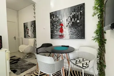 a dining room with a table and chairs at Alfa house in the center! in Athens