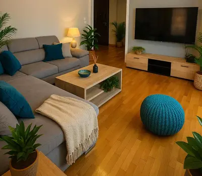 a living room with a couch and a flat screen tv at Sunny Escape in Alimos, close to the beach in Athens
