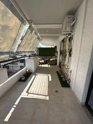 a hallway of a building with some plants on it at Piraeus Seaside Apartment Escape in Piraeus