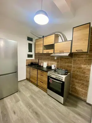 a kitchen with a stove and a refrigerator at Sweety Flat Marina Zeas Piraeus in Piraeus