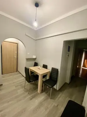 a room with a table and chairs in an office at Sweety Flat Marina Zeas Piraeus in Piraeus