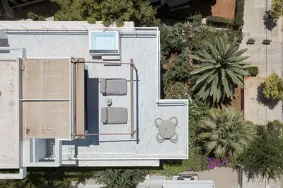 an overhead view of a house with a pool at The Vouliagmeni Penthouse in Athens